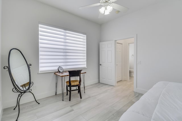 bedroom featuring light wood-style flooring, baseboards, and ceiling fan