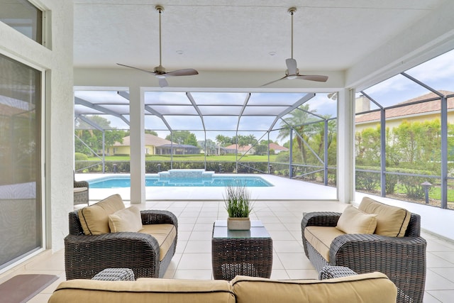 sunroom featuring outdoor lounge area, a swimming pool, and ceiling fan