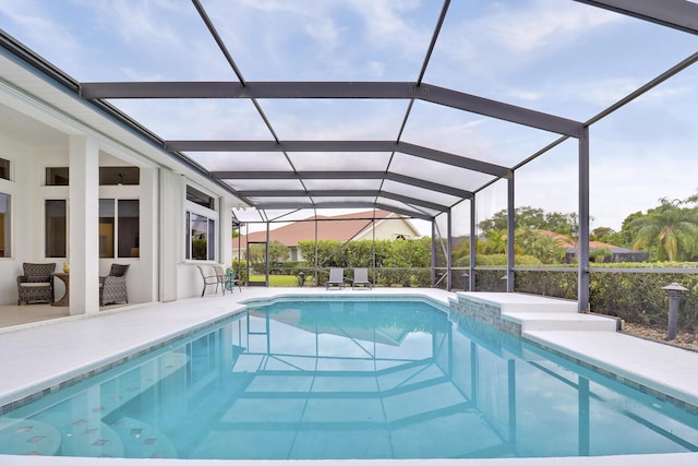 pool with a patio and a lanai