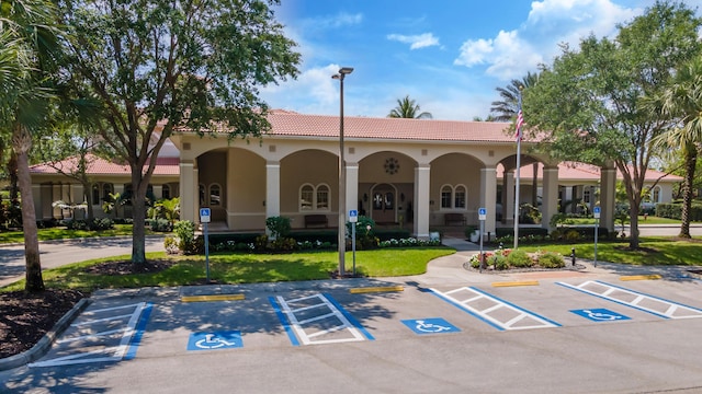 view of property with uncovered parking