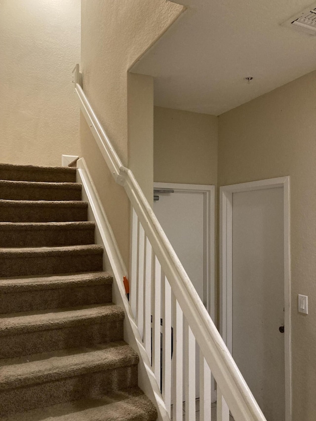 3203 Shoma Dr Unit 294/32, Royal Palm Beach, FL 33414 - staircase featuring a textured wall