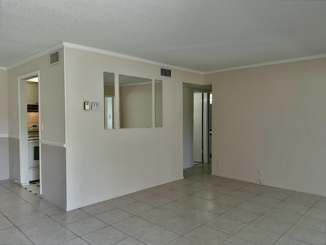 12394 Alternate A1A O7, Palm Beach Gardens, FL 33410 - spare room featuring light tile patterned floors, visible vents, and ornamental molding