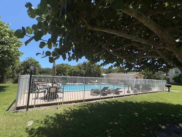 12394 Alternate A1A O7, Palm Beach Gardens, FL 33410 - pool featuring a yard, a patio area, and fence