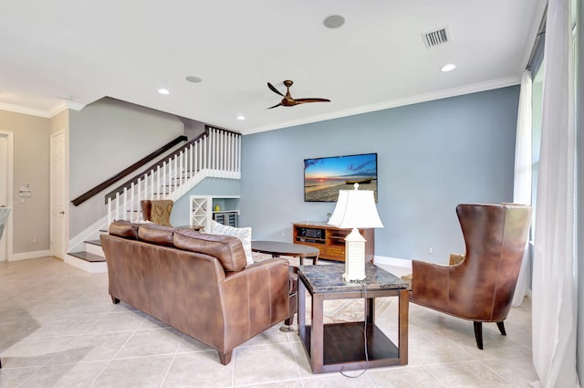 living room with stairs, visible vents, ornamental molding, and light tile patterned flooring