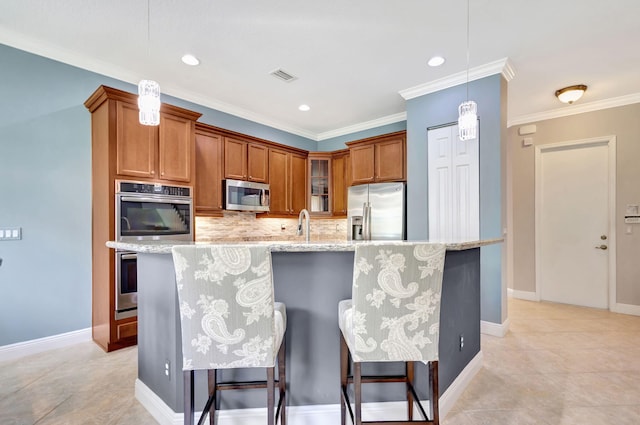 kitchen featuring tasteful backsplash, glass insert cabinets, visible vents, brown cabinets, and appliances with stainless steel finishes