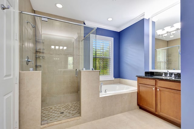 bathroom with a shower stall, tile patterned floors, vanity, and a bath