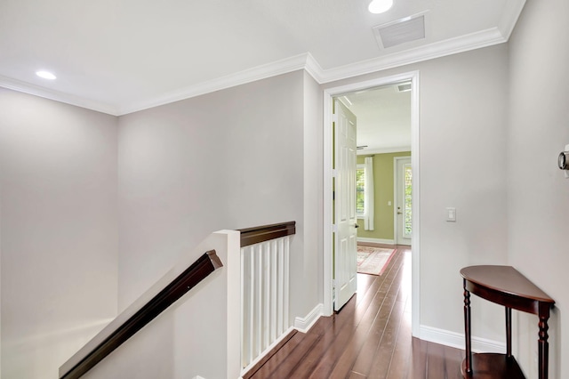 hallway featuring dark wood-style flooring, baseboards, recessed lighting, an upstairs landing, and visible vents
