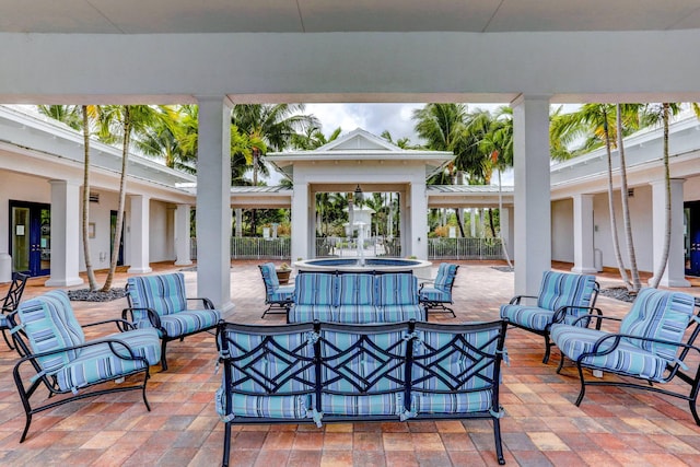 view of patio featuring an outdoor living space and fence