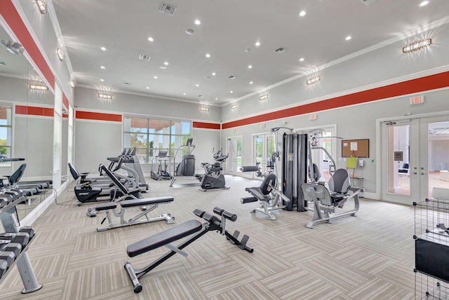 gym featuring crown molding, french doors, baseboards, and visible vents