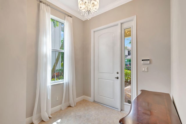 foyer entrance with ornamental molding, baseboards, an inviting chandelier, and light tile patterned flooring