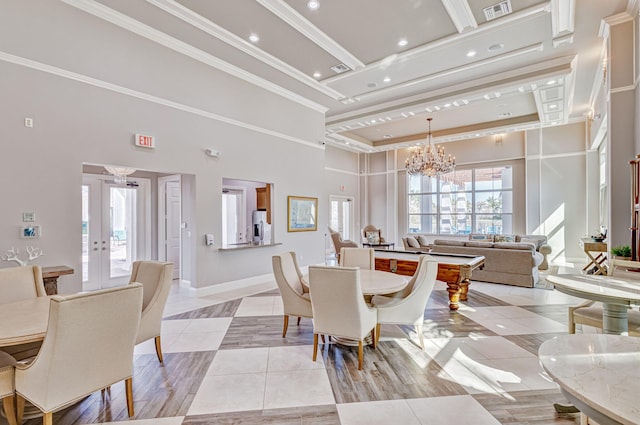dining space featuring a towering ceiling, an inviting chandelier, light tile patterned floors, french doors, and visible vents