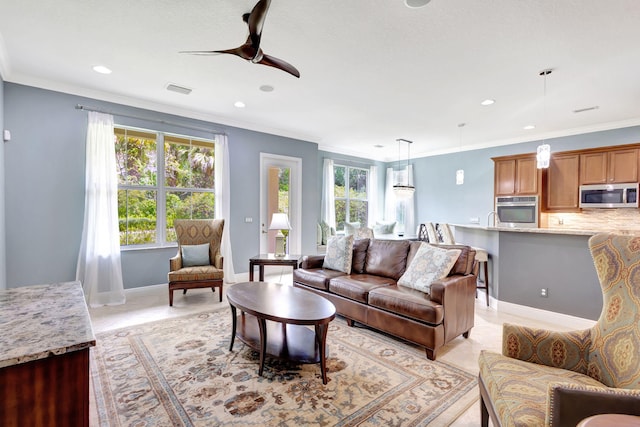 living room featuring recessed lighting, visible vents, a ceiling fan, and crown molding