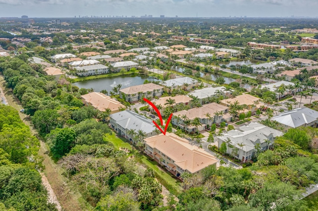 birds eye view of property featuring a residential view and a water view