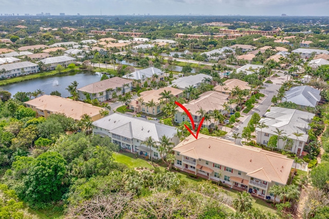 birds eye view of property featuring a residential view and a water view