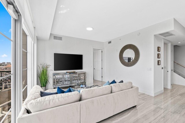 living room featuring visible vents and baseboards