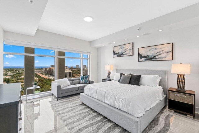 bedroom featuring a city view