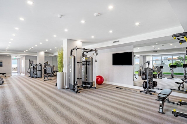 exercise room with recessed lighting, baseboards, visible vents, and carpet