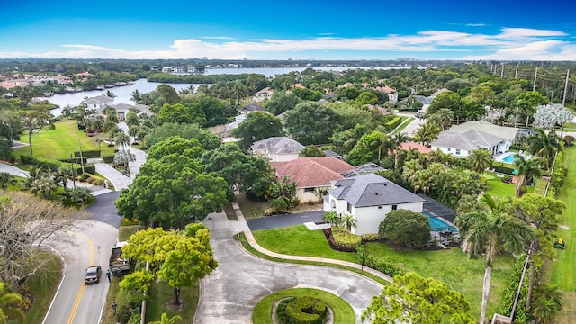 birds eye view of property featuring a water view and a residential view
