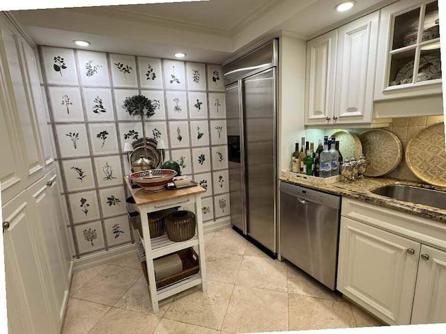 434 Chilean Ave Unit 2B, Palm Beach, FL 33480 - kitchen with stone countertops, recessed lighting, light tile patterned floors, ornamental molding, and stainless steel appliances