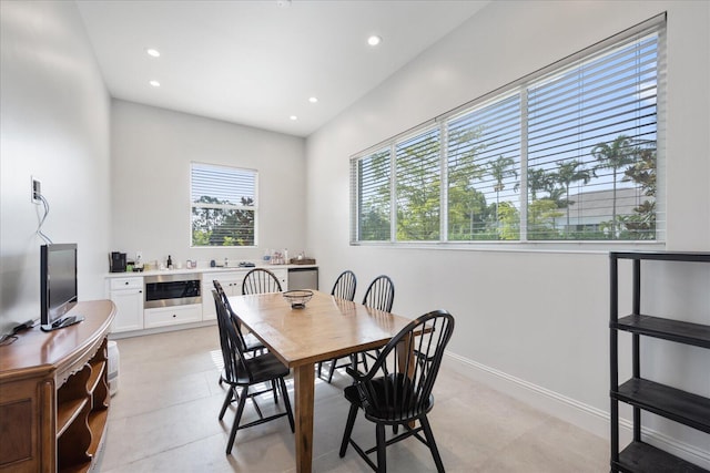 dining room featuring recessed lighting and baseboards