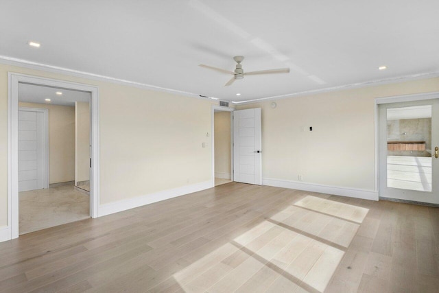 empty room with light wood-style floors, a ceiling fan, and ornamental molding