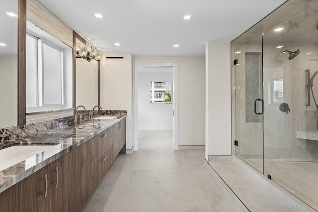 bathroom featuring recessed lighting, a sink, double vanity, and a stall shower