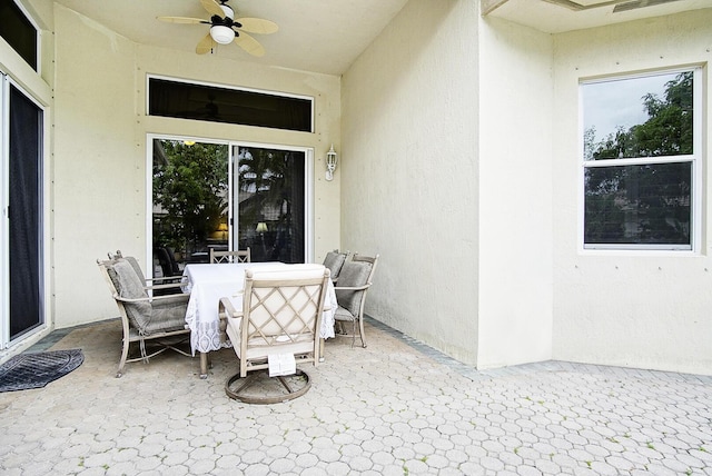 view of patio featuring ceiling fan and outdoor dining space