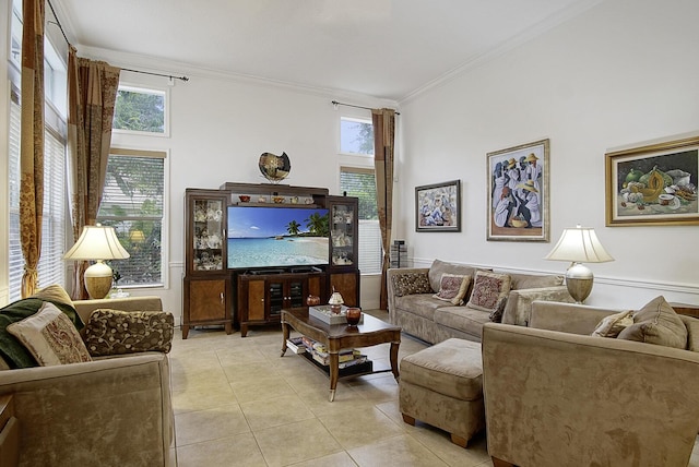 living area featuring ornamental molding and light tile patterned floors