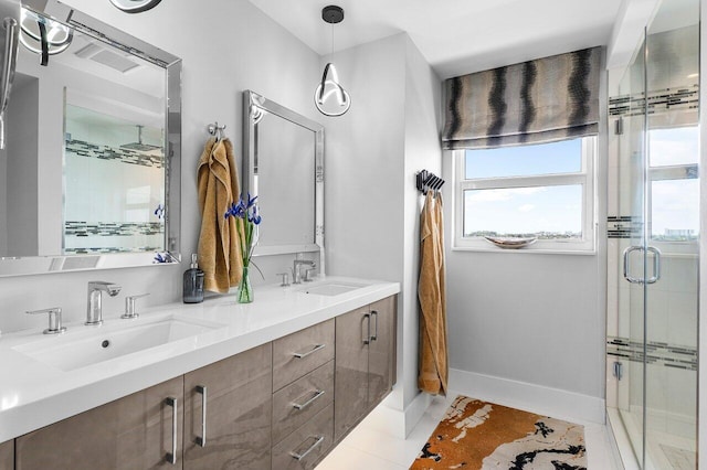 400 Seasage Dr Unit 804, Delray Beach, FL 33483 - full bath with baseboards, double vanity, a stall shower, and a sink