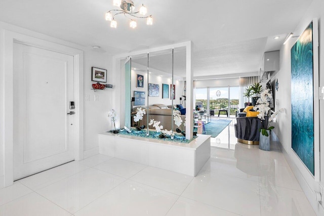 400 Seasage Dr Unit 804, Delray Beach, FL 33483 - tiled foyer entrance featuring a notable chandelier