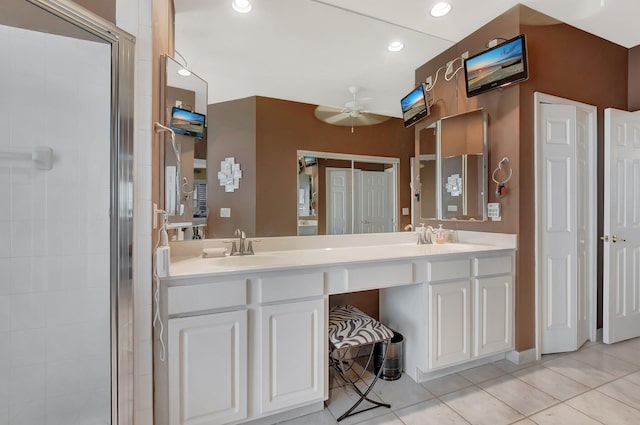 21504 Halstead Dr, Boca Raton, FL 33428 - bathroom featuring a ceiling fan, tile patterned flooring, a stall shower, double vanity, and recessed lighting