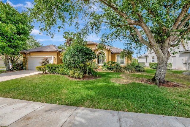 21504 Halstead Dr, Boca Raton, FL 33428 - view of property hidden behind natural elements featuring stucco siding, driveway, a front yard, an attached garage, and a tile roof