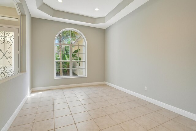 21504 Halstead Dr, Boca Raton, FL 33428 - unfurnished living room with a ceiling fan, arched walkways, baseboards, and light tile patterned flooring