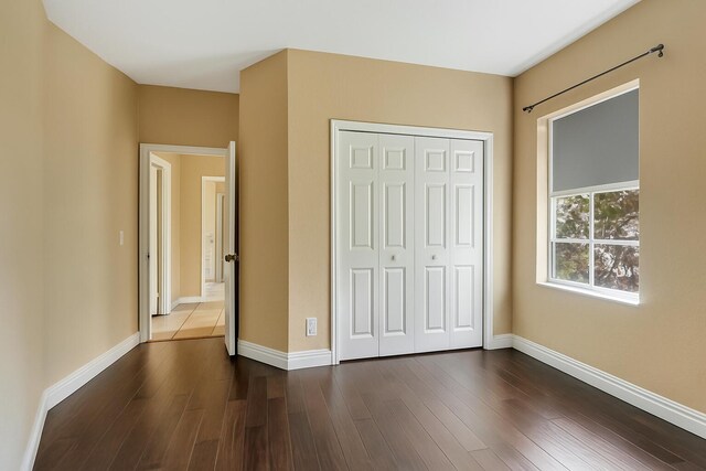 21504 Halstead Dr, Boca Raton, FL 33428 - empty room with baseboards and dark wood finished floors