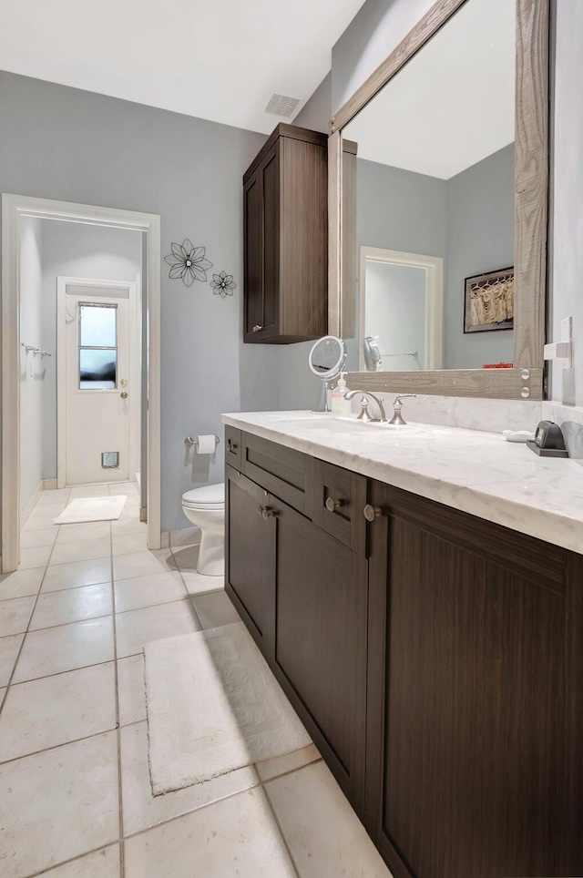 21504 Halstead Dr, Boca Raton, FL 33428 - bathroom with toilet, vanity, and tile patterned floors