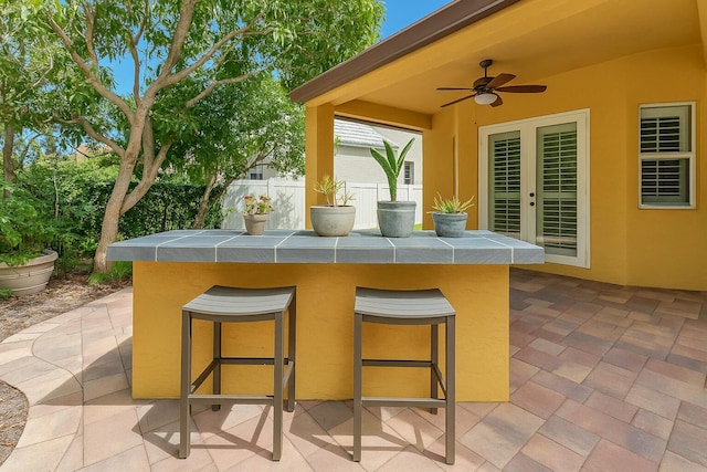 21504 Halstead Dr, Boca Raton, FL 33428 - view of patio / terrace featuring fence, a ceiling fan, and french doors