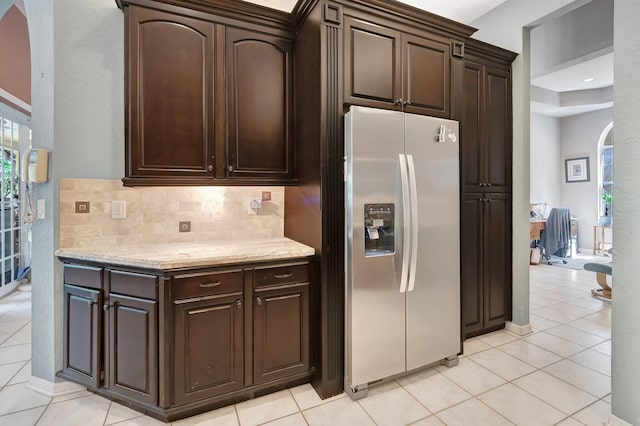 21504 Halstead Dr, Boca Raton, FL 33428 - kitchen featuring stainless steel fridge with ice dispenser, arched walkways, tasteful backsplash, and dark brown cabinets