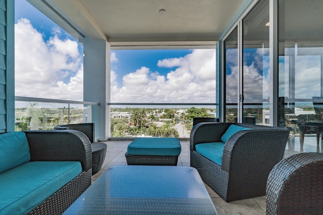 exterior space featuring a balcony and an outdoor hangout area