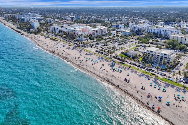 birds eye view of property with a view of the beach and a water view