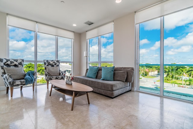 living area with visible vents, recessed lighting, and plenty of natural light