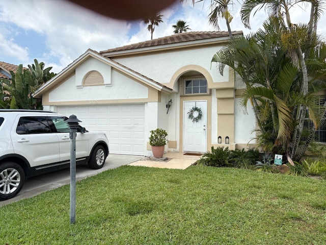 view of front facade featuring stucco siding, an attached garage, concrete driveway, and a front lawn