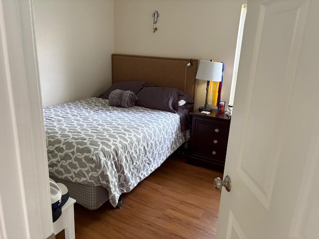bedroom featuring wood finished floors