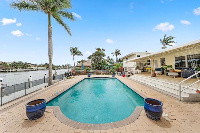 442 SE 17th Ter, Deerfield Beach, FL 33441 - view of pool featuring a water view, a patio area, fence, and a fenced in pool