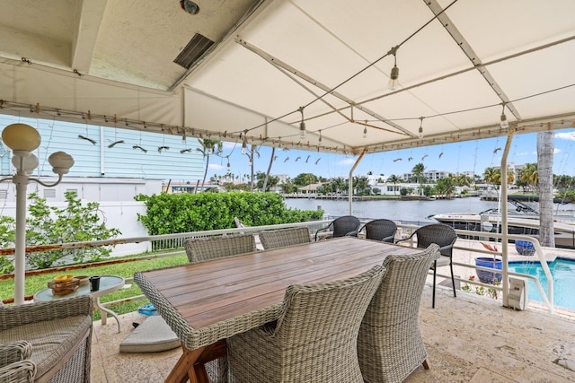 442 SE 17th Ter, Deerfield Beach, FL 33441 - view of patio / terrace featuring outdoor dining space, an outdoor pool, and a water view
