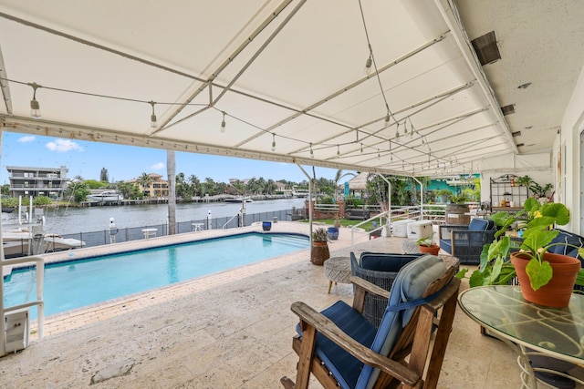 442 SE 17th Ter, Deerfield Beach, FL 33441 - view of pool with a patio, a dock, a fenced in pool, and a water view