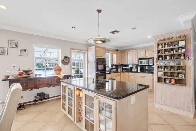 442 SE 17th Ter, Deerfield Beach, FL 33441 - kitchen with visible vents, stainless steel microwave, light brown cabinets, and dobule oven black