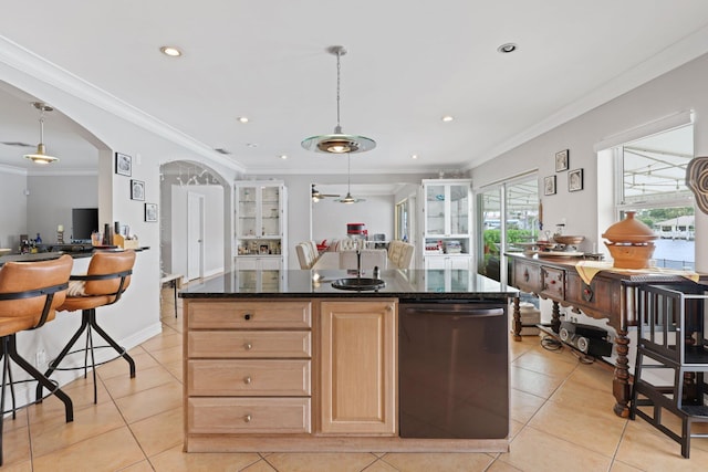 442 SE 17th Ter, Deerfield Beach, FL 33441 - kitchen with light tile patterned floors, a center island, decorative light fixtures, stainless steel dishwasher, and light brown cabinetry