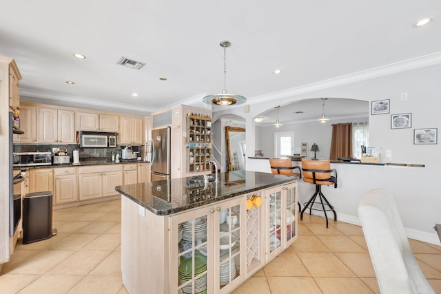 442 SE 17th Ter, Deerfield Beach, FL 33441 - kitchen with visible vents, appliances with stainless steel finishes, glass insert cabinets, and light tile patterned floors