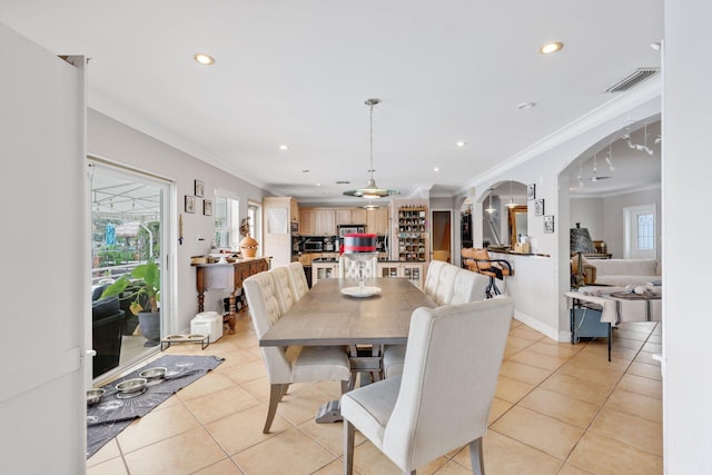 442 SE 17th Ter, Deerfield Beach, FL 33441 - dining area featuring light tile patterned floors, visible vents, and crown molding