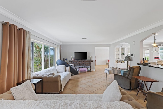 442 SE 17th Ter, Deerfield Beach, FL 33441 - living area with arched walkways, light tile patterned floors, crown molding, and visible vents